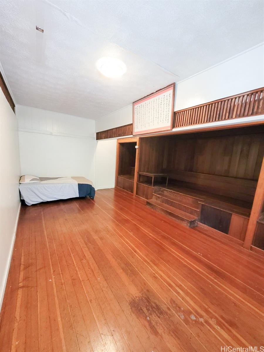 82 Hoku Street, Unit D Hilo, HI 96720 - Photo 4 of 15 a view of livingroom with furniture and wooden floor