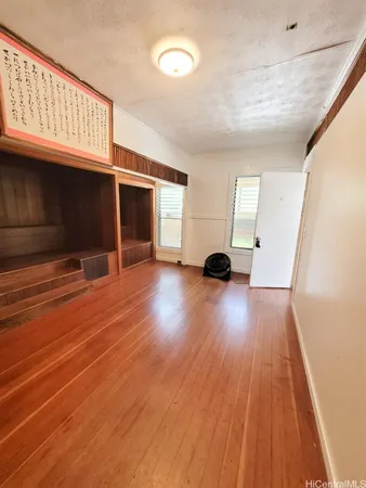 a view of a livingroom with wooden floor