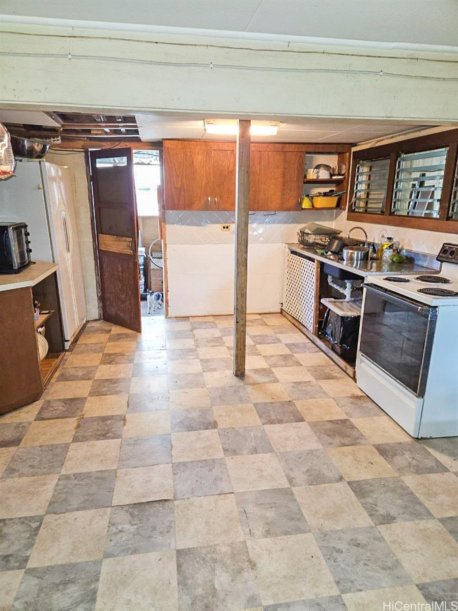 82 Hoku Street, Unit D Hilo, HI 96720 - Photo 7 of 15 a view of a kitchen with a sink