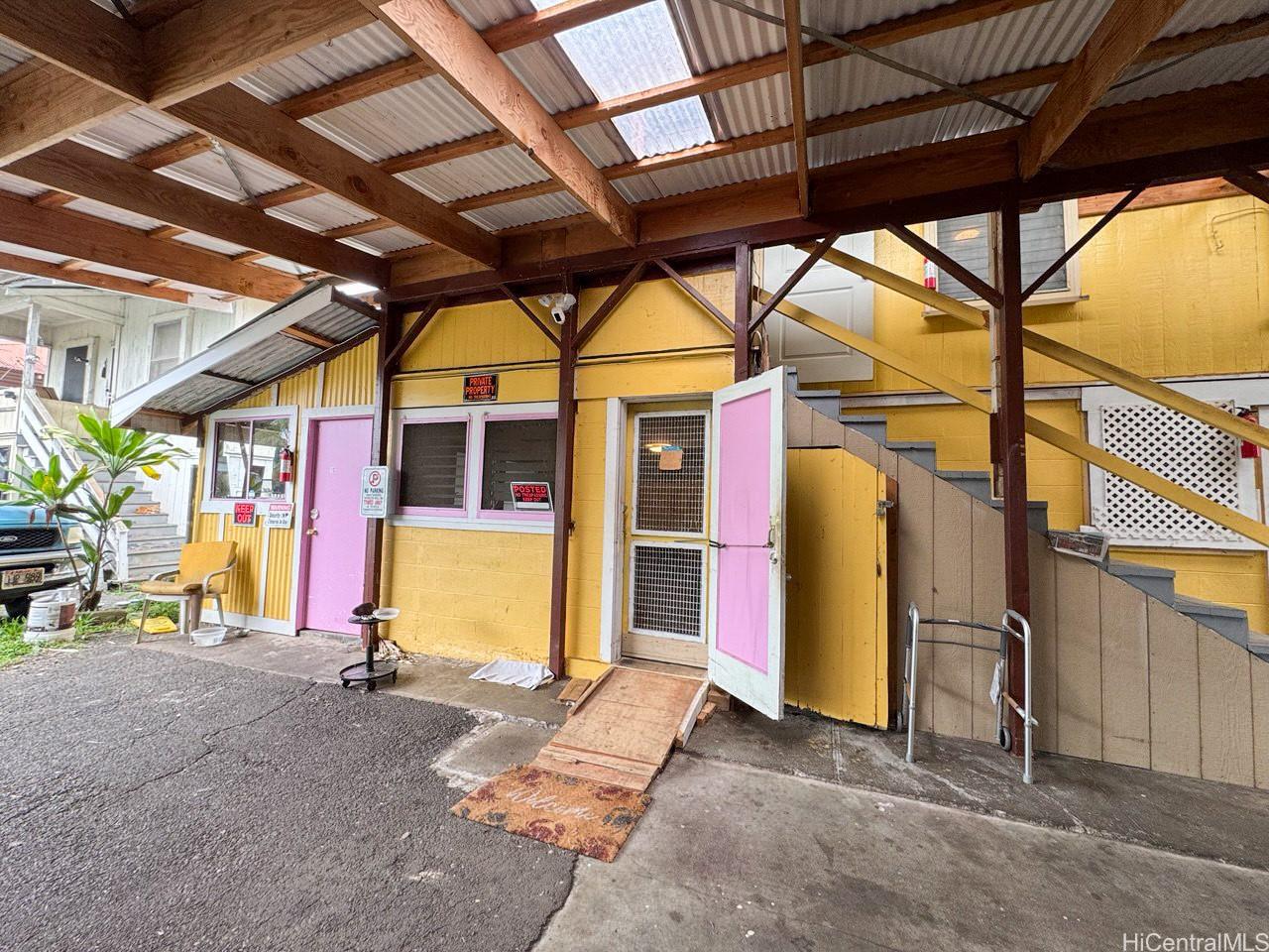 82 Hoku Street, Unit D Hilo, HI 96720 - Photo 10 of 15 a view of a room with wooden walls