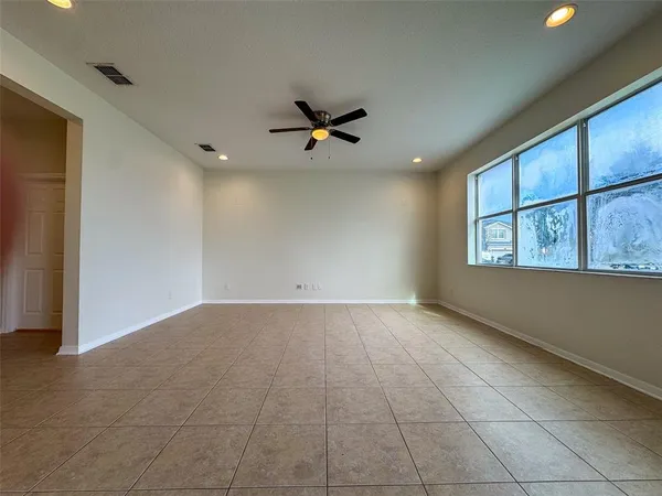 a view of an empty room with a window
