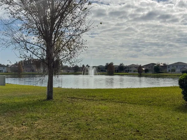 a view of a lake with a yard