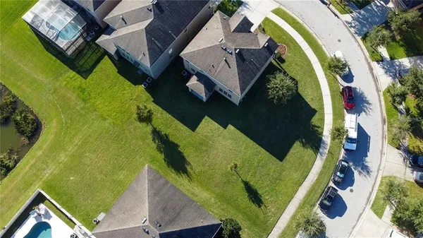 an aerial view of a house with swimming pool