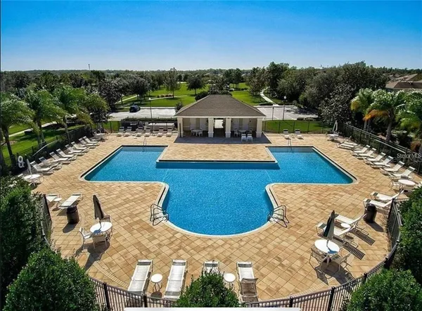 a view of a swimming pool with lounge chair