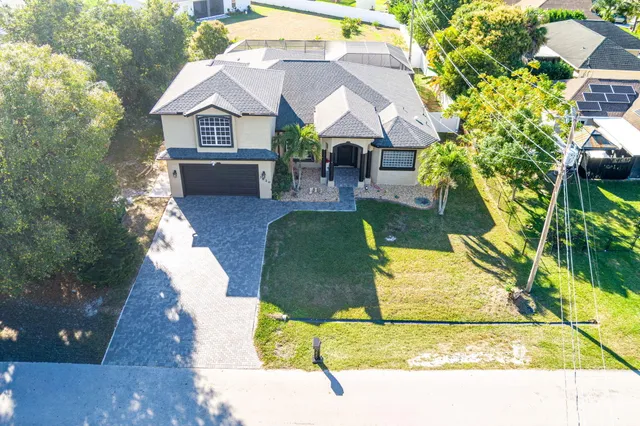 $619,900 | 3820 Southwest Cheribon Street, Port St. Lucie, FL 34953