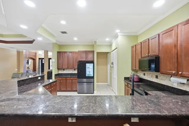 $619,900 | 3820 Southwest Cheribon Street, Port St. Lucie, FL 34953