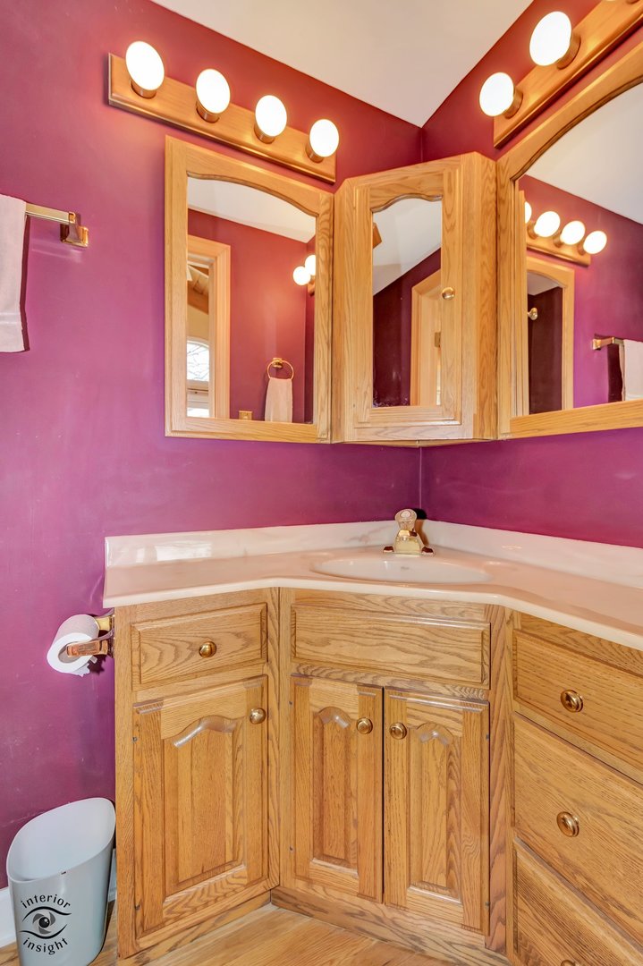 2815 Helen Drive Glenview, IL 60025 - Photo 28 of 40 a bathroom with a sink mirror and a toilet