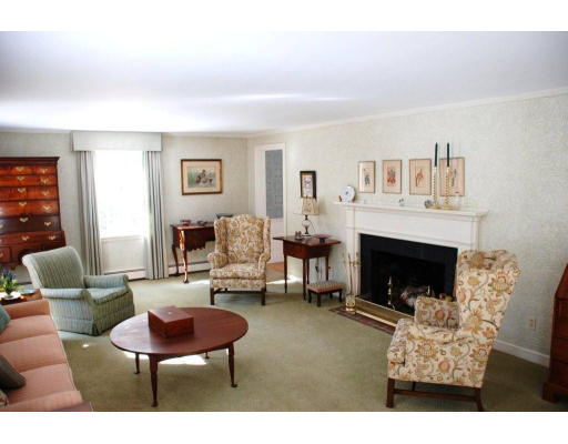 94 Sears Road Wayland, MA 01778 - Photo 2 of 6 a living room with furniture and a fireplace