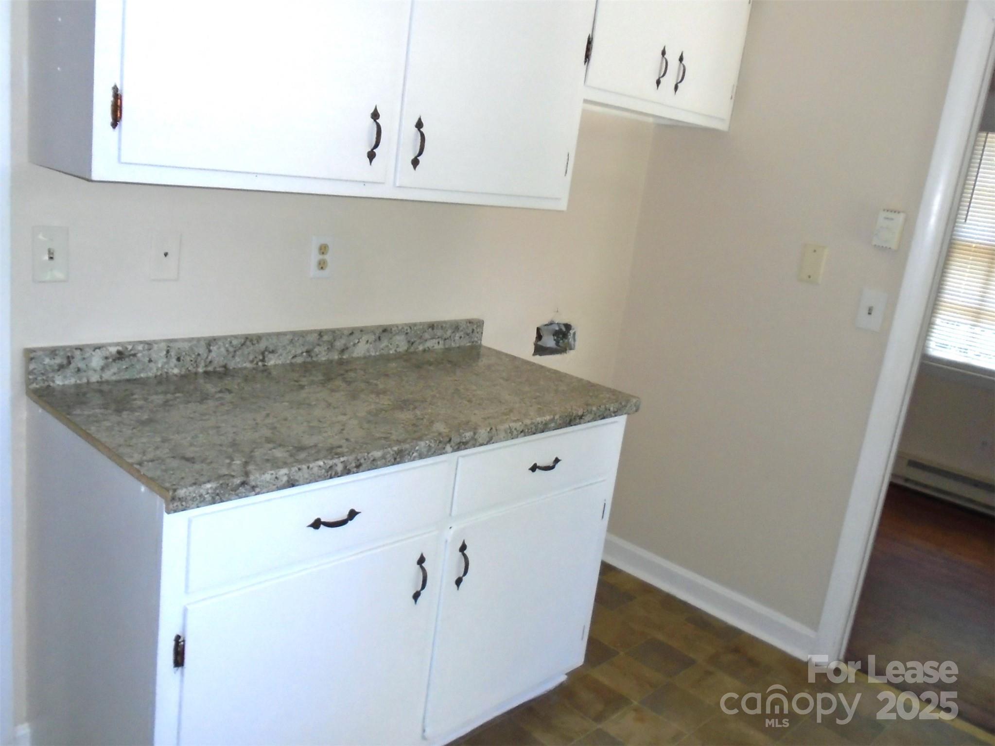 4227 Walker Road, Unit 1 Charlotte, NC 28211 - Photo 3 of 9 a view white cabinets and a sink