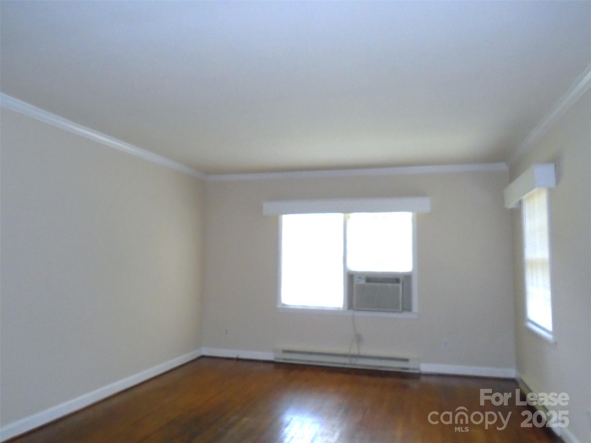 4227 Walker Road, Unit 1 Charlotte, NC 28211 - Photo 4 of 9 an empty room with a window