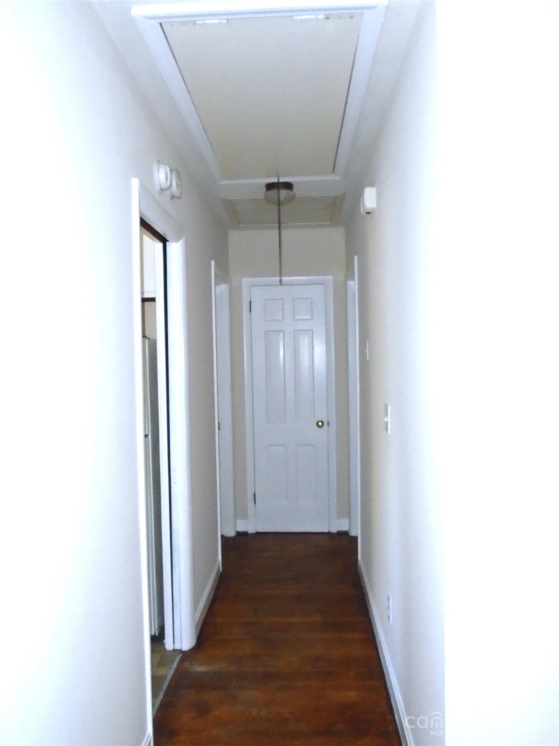 4227 Walker Road, Unit 1 Charlotte, NC 28211 - Photo 6 of 9 a view of a hallway with wooden floor