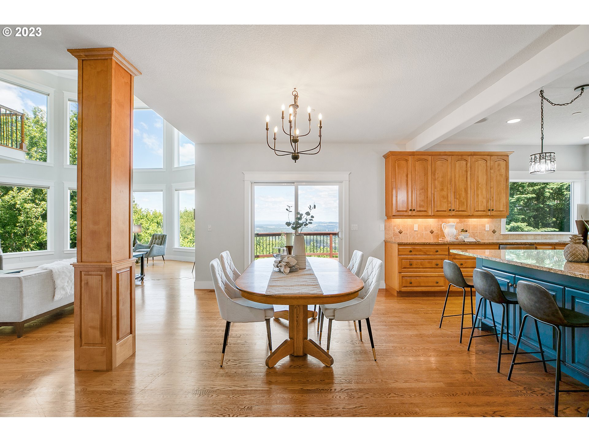 17505 Southwest Parrett Mountain Road Sherwood, OR 97140 - Photo 12 of 48 a view of a dining room with furniture window and wooden floor
