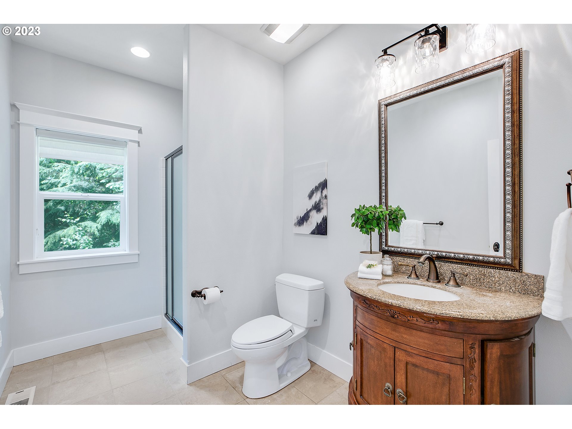 17505 Southwest Parrett Mountain Road Sherwood, OR 97140 - Photo 19 of 48 a bathroom with a toilet sink and mirror