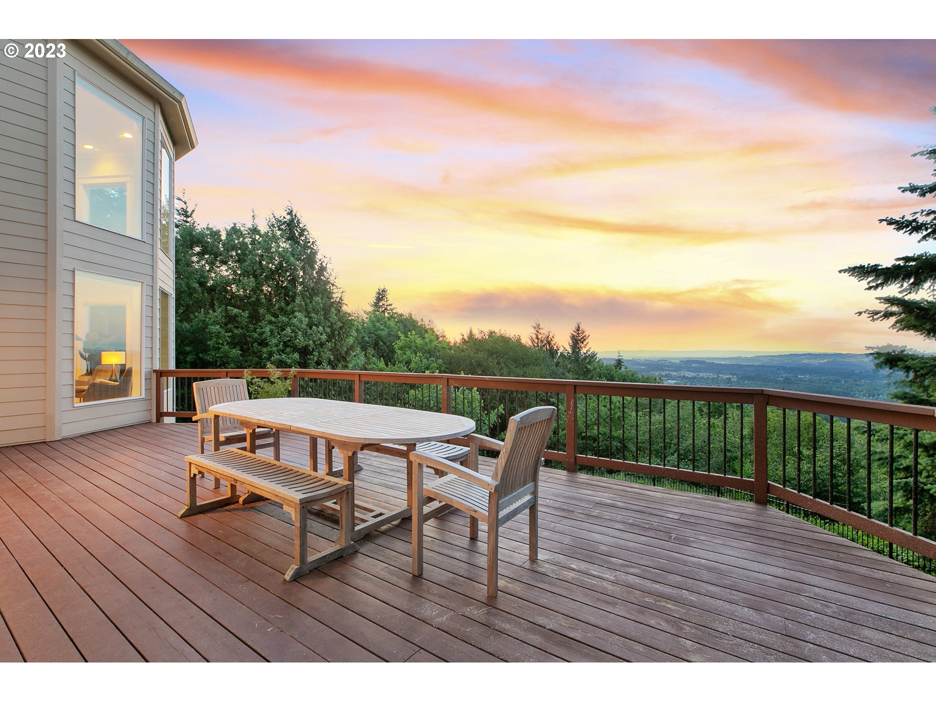 17505 Southwest Parrett Mountain Road Sherwood, OR 97140 - Photo 40 of 48 a balcony with wooden floor table and chairs
