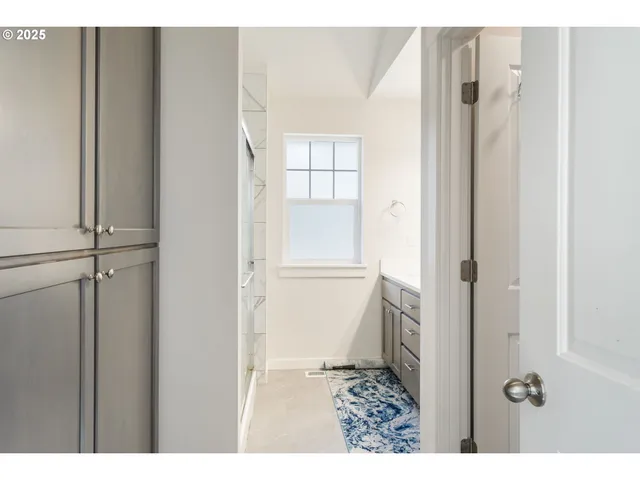 a bathroom with a sink double vanity and a mirror