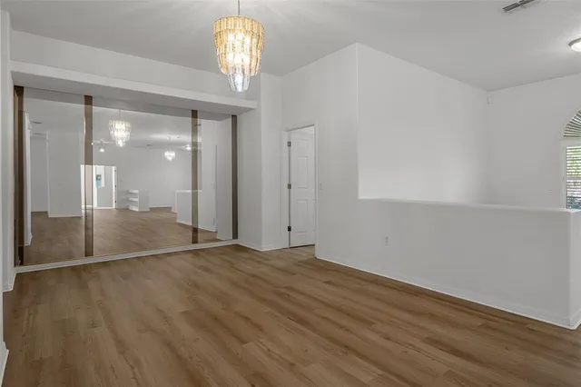 a kitchen with granite countertop a sink stove and refrigerator
