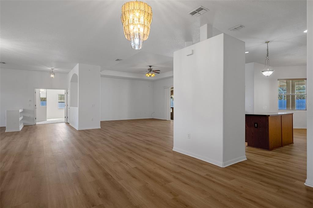 7285 Nightwalker Road Weeki Wachee, FL 34613 - Photo 18 of 79 an empty room with wooden floor and windows