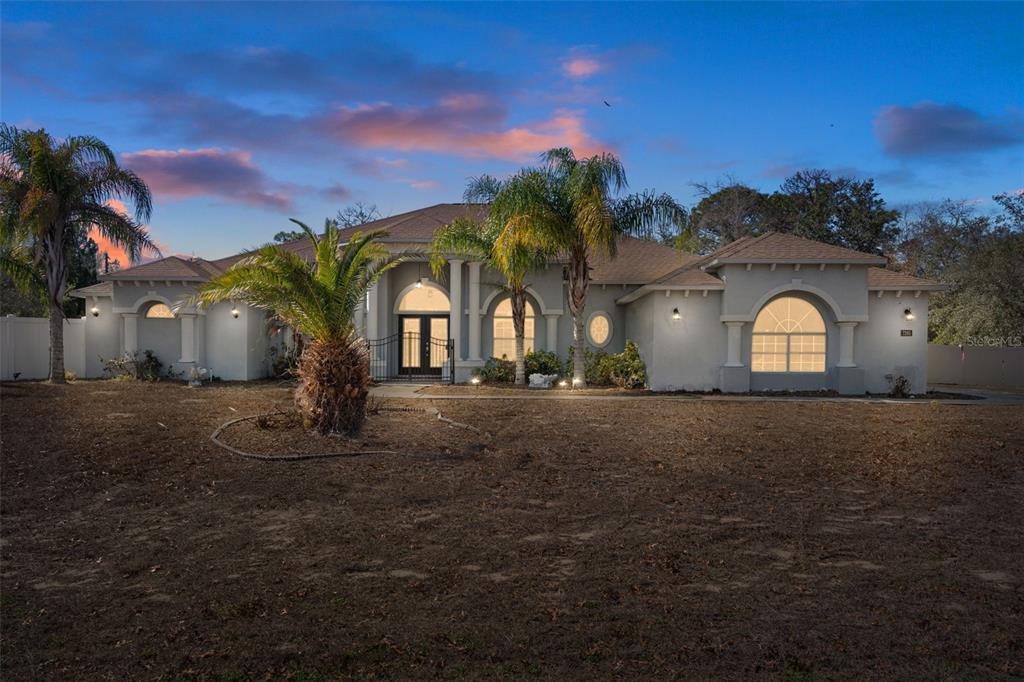 7285 Nightwalker Road Weeki Wachee, FL 34613 - Photo 2 of 79 a house view with a garden space