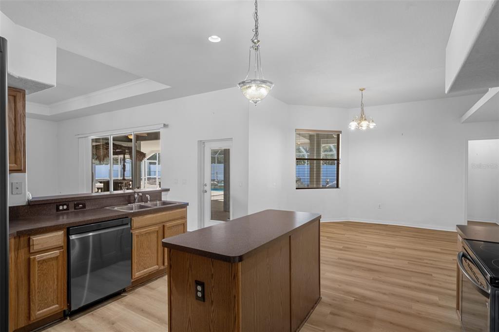 7285 Nightwalker Road Weeki Wachee, FL 34613 - Photo 29 of 79 a kitchen with stainless steel appliances granite countertop a stove a sink and a refrigerator