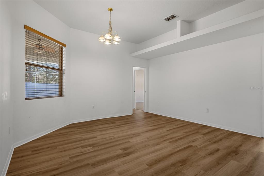 7285 Nightwalker Road Weeki Wachee, FL 34613 - Photo 30 of 79 a view of empty room with wooden floor
