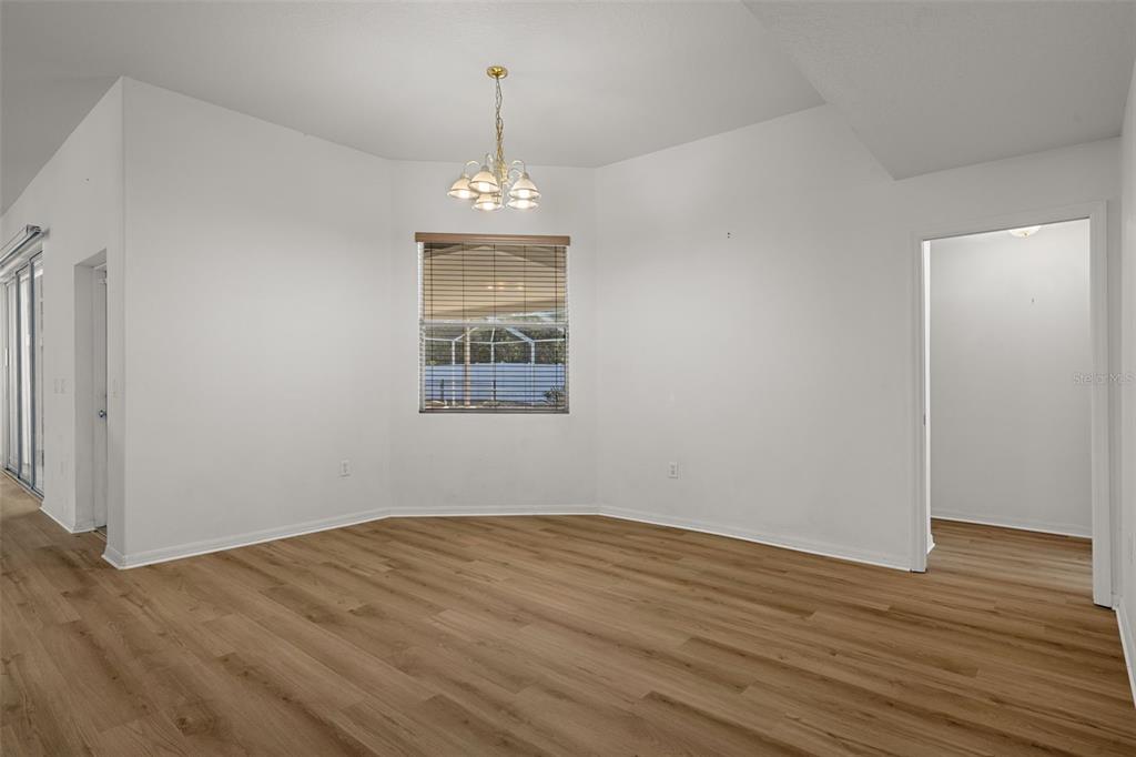 7285 Nightwalker Road Weeki Wachee, FL 34613 - Photo 31 of 79 a view of empty room with wooden floor