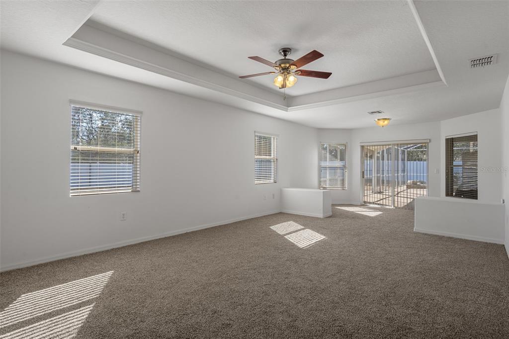 7285 Nightwalker Road Weeki Wachee, FL 34613 - Photo 33 of 79 a view of a livingroom with a ceiling fan and window