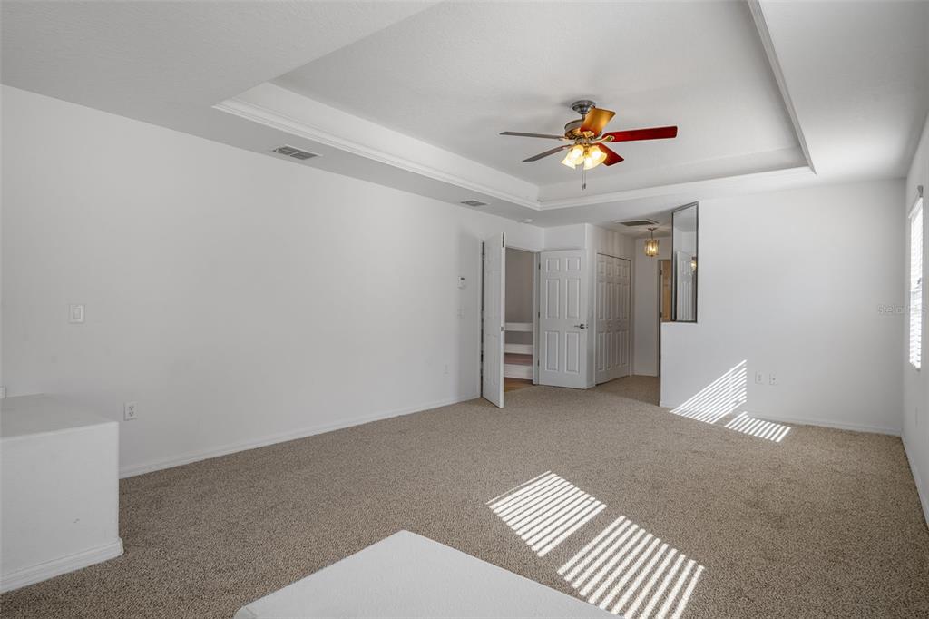 7285 Nightwalker Road Weeki Wachee, FL 34613 - Photo 36 of 79 a view of an empty room with a ceiling fan