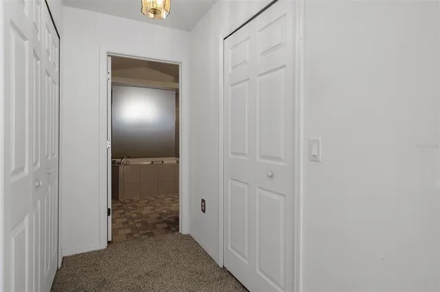 a room with lots of windows and wooden fence