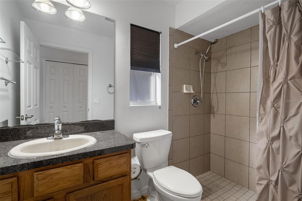 7285 Nightwalker Road Weeki Wachee, FL 34613 - Photo 53 of 79 a bathroom with a sink toilet and shower