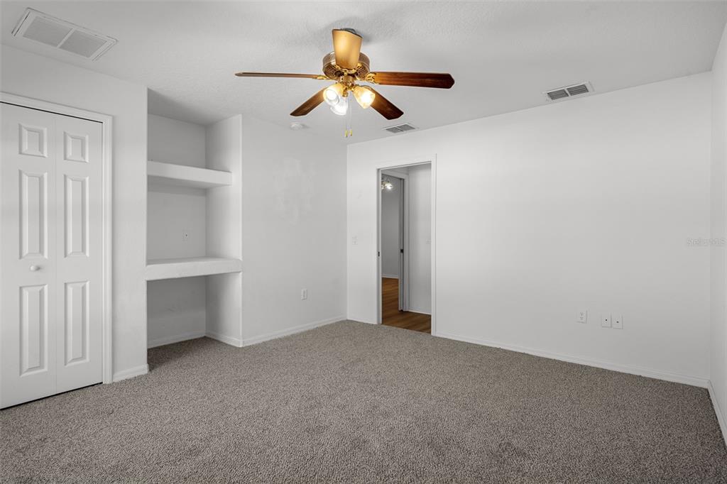 7285 Nightwalker Road Weeki Wachee, FL 34613 - Photo 55 of 79 a view of an empty room with a ceiling fan
