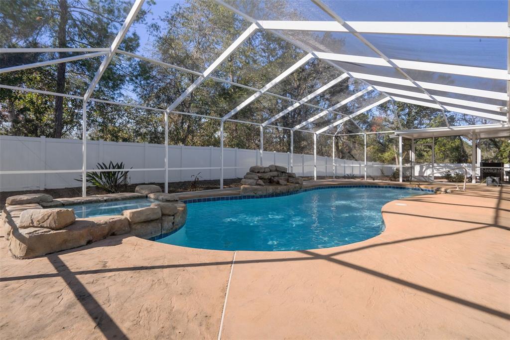7285 Nightwalker Road Weeki Wachee, FL 34613 - Photo 64 of 79 a view of a swimming pool with a patio