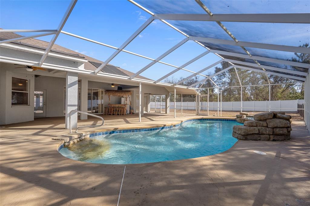 7285 Nightwalker Road Weeki Wachee, FL 34613 - Photo 66 of 79 a view of a swimming pool with a patio