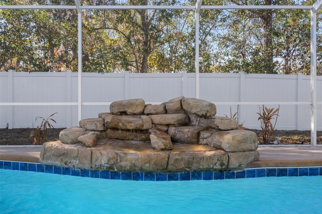 7285 Nightwalker Road Weeki Wachee, FL 34613 - Photo 69 of 79 a living room with furniture and a large window