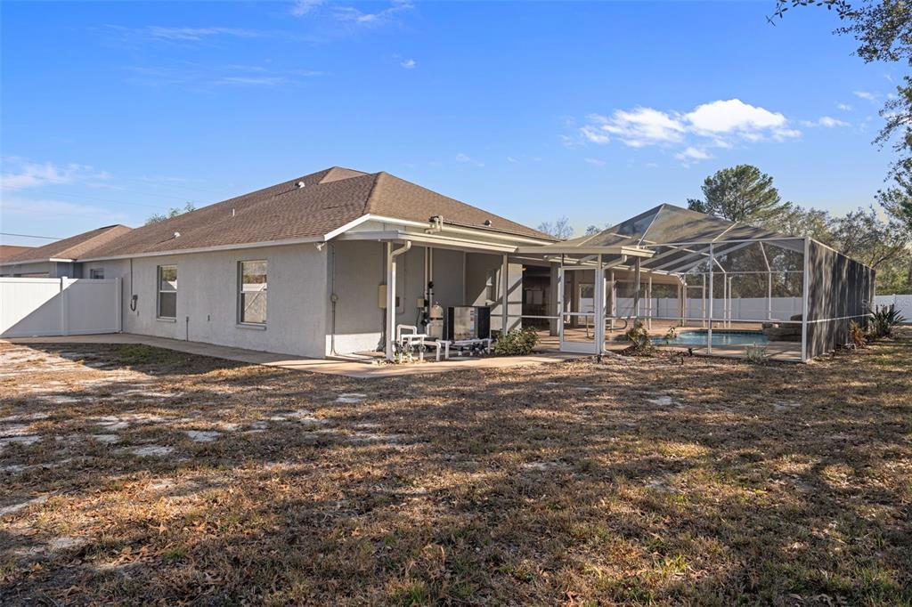 7285 Nightwalker Road Weeki Wachee, FL 34613 - Photo 71 of 79 a front view of a house with a yard