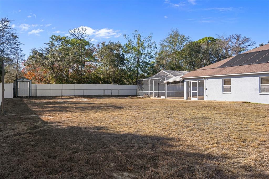 7285 Nightwalker Road Weeki Wachee, FL 34613 - Photo 74 of 79 a view of a house with a yard