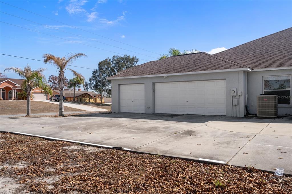 7285 Nightwalker Road Weeki Wachee, FL 34613 - Photo 75 of 79 a front view of a house with a yard and garage