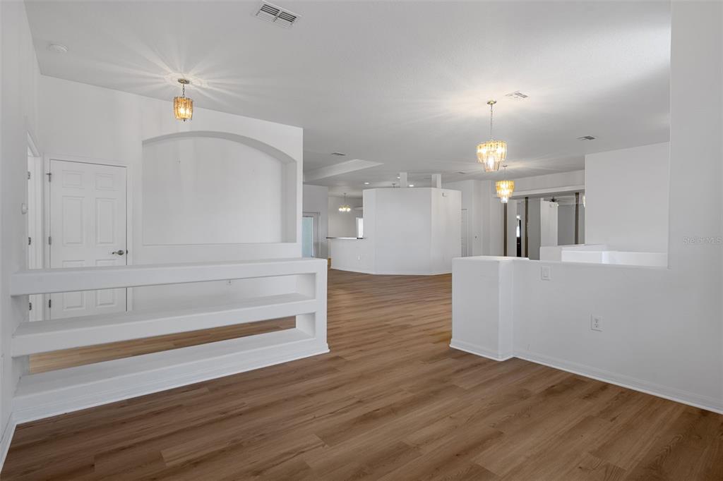 7285 Nightwalker Road Weeki Wachee, FL 34613 - Photo 10 of 79 a view of kitchen and hall with wooden floor