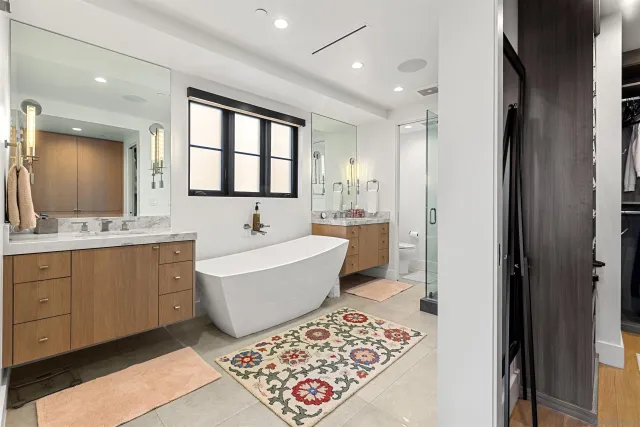 a bedroom with furniture and a flat screen tv