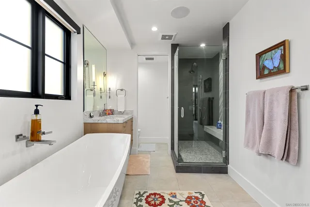 a bedroom with furniture and a wooden floor