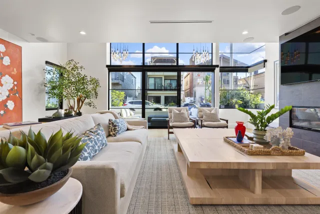 a kitchen with stainless steel appliances granite countertop a stove top oven a sink dishwasher and white cabinets