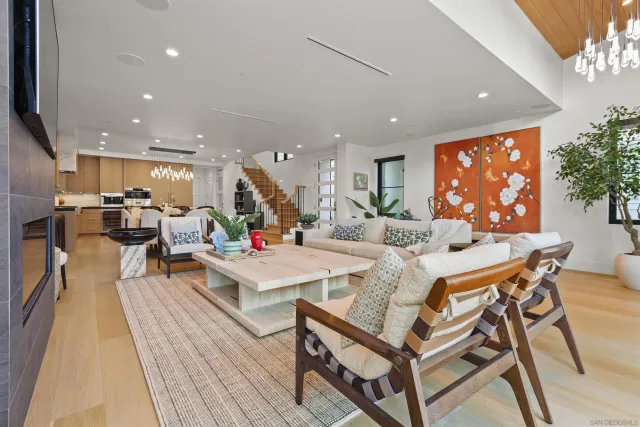 a large kitchen with a table and chairs