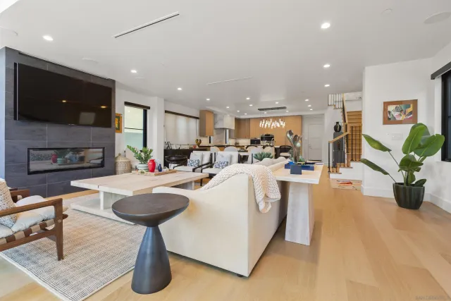 a bathroom with a tub a mirror and a shower