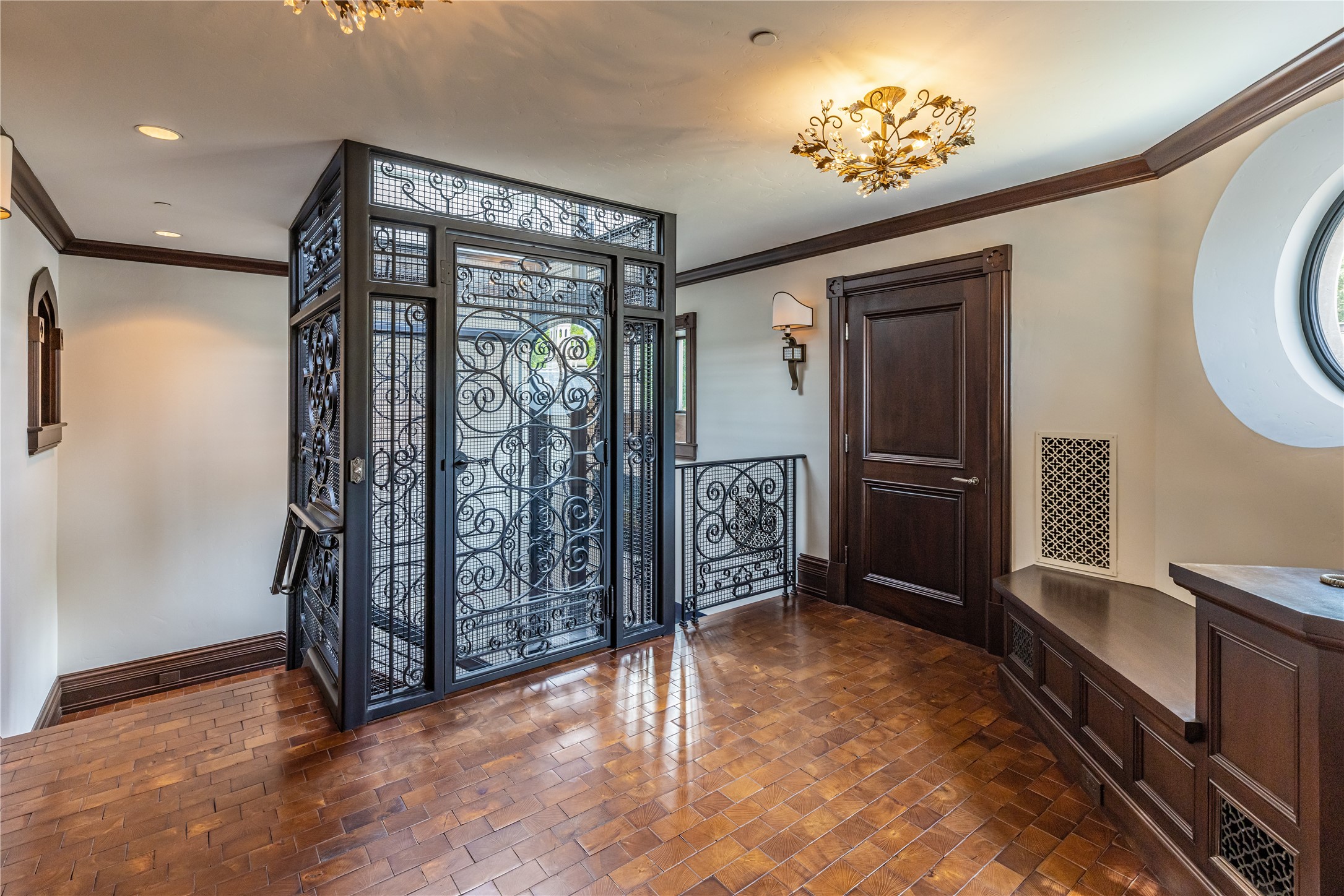 107 Timberwilde Lane Houston, TX 77024 - Photo 17 of 40 A glass-and-iron elevator crowned with a skylight grants seamless access to all levels of the residence. Homes of this caliber are rarely offered—this one captivates with rare character, architectural distinction, and thoughtful detailing throughout.