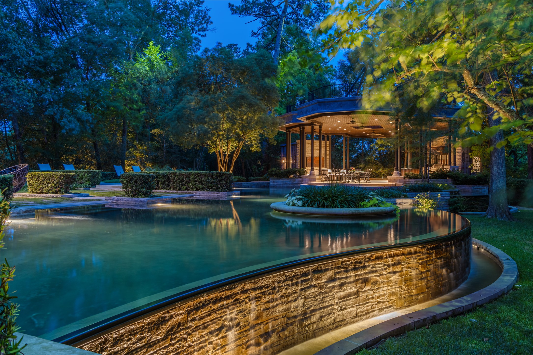107 Timberwilde Lane Houston, TX 77024 - Photo 22 of 40 The glowing pool offers an escape under the stars and relaxation that feels worlds away from the city’s bustle.