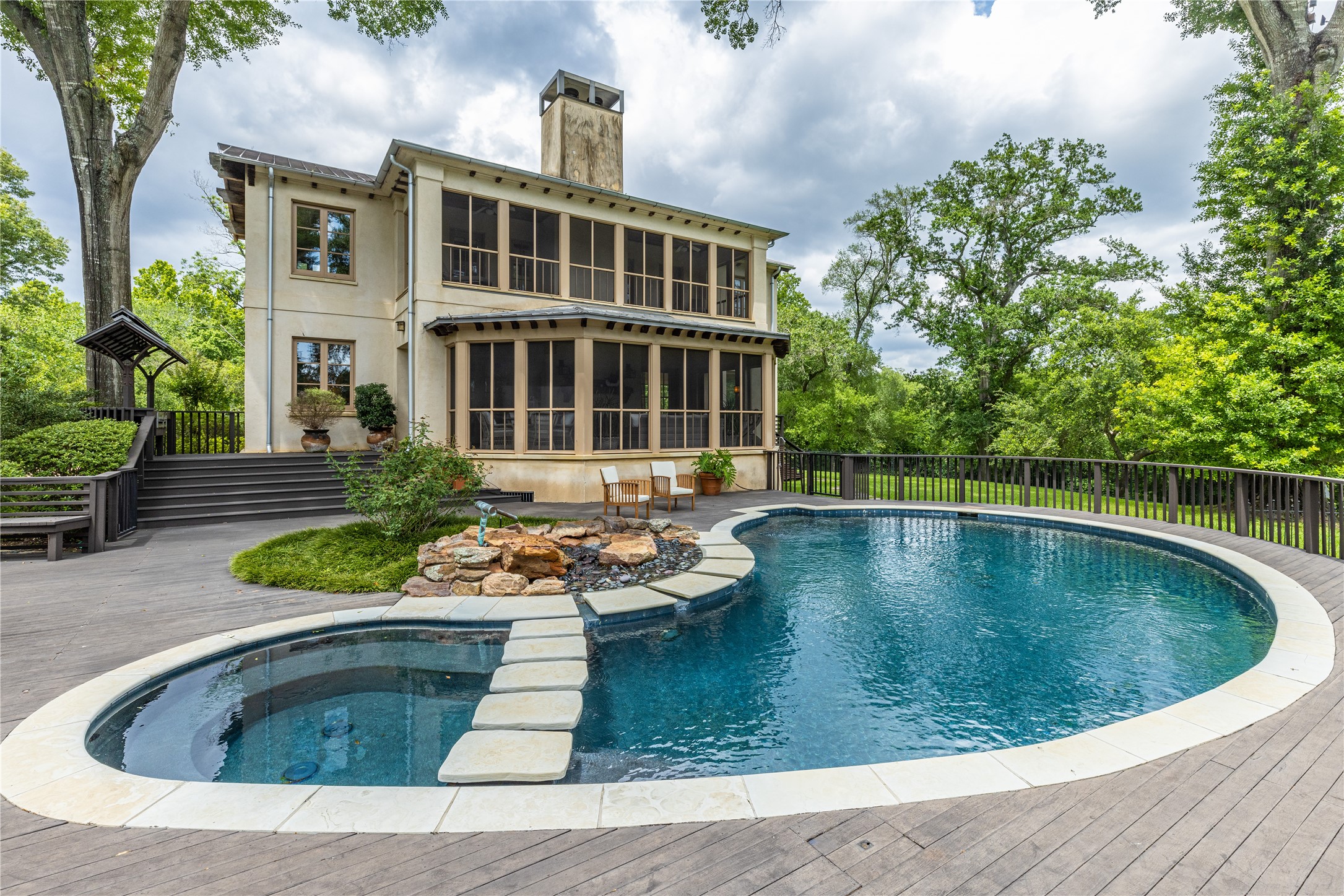 107 Timberwilde Lane Houston, TX 77024 - Photo 29 of 40 The guest house pool and spa are complemented by expansive decking, sunning areas, and an outdoor grill, overlooking the prestigious Houston Country Club.