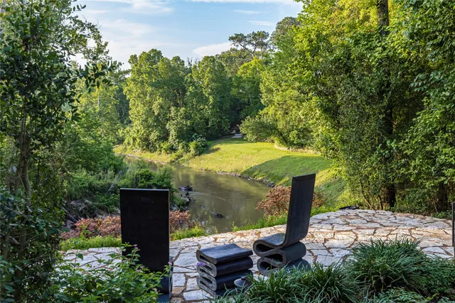 an outdoor space with furniture and garden
