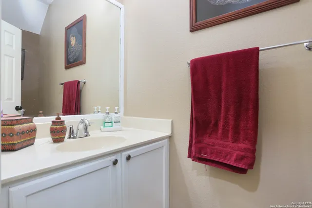 a bathroom with a sink and a mirror