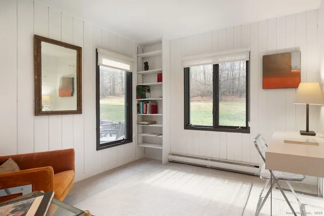 a bathroom with a sink toilet and mirror