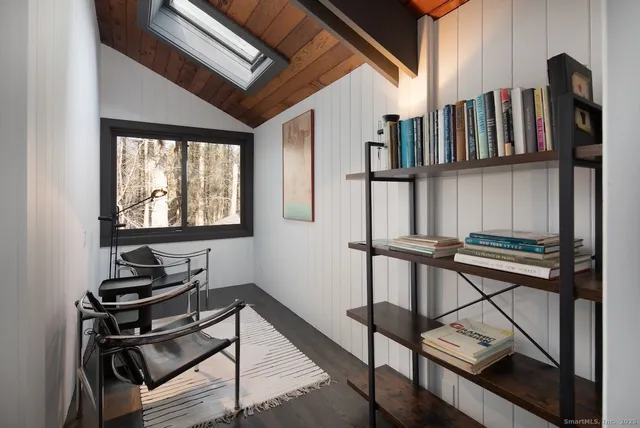 a spacious bedroom with two beds and windows