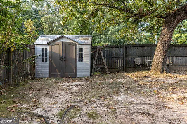 a house with a tree in the background